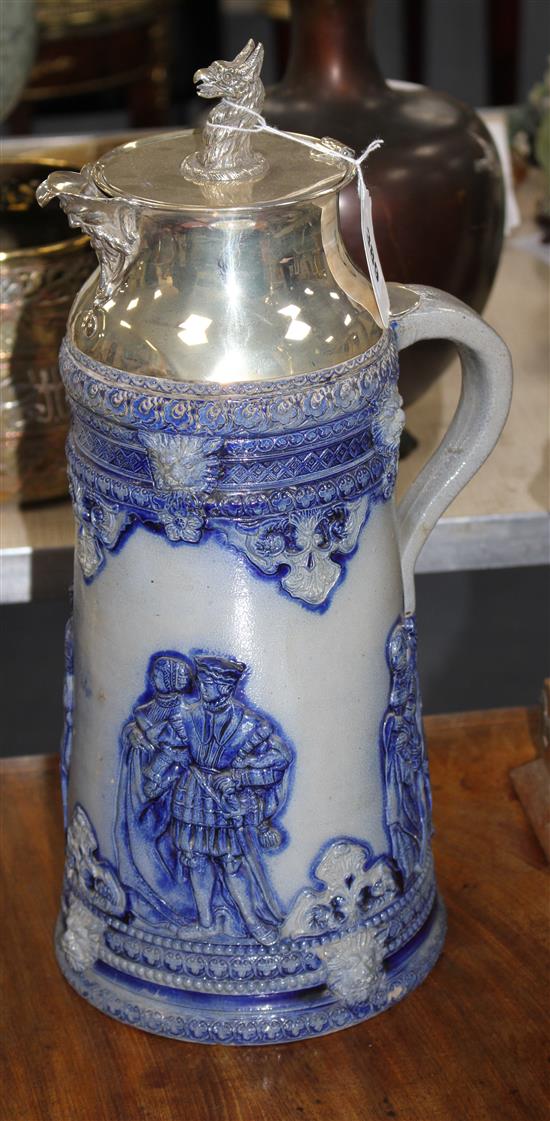 An early 20th century blue glazed German stoneware flagon, with silver plated griffon head mount, height 40cm